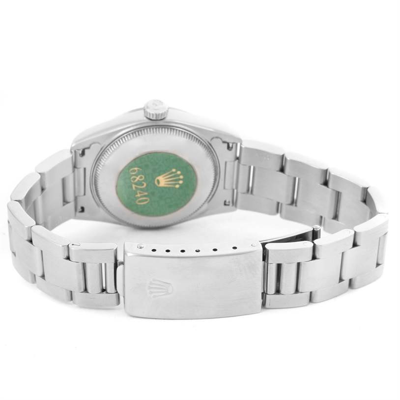 The image shows the backside and clasp of a Rolex Mid-Size 68240 Women's Stainless Steel Blue Dial 68240 Women's Stainless Steel Blue Dial model watch, including the case back and oyster bracelet.