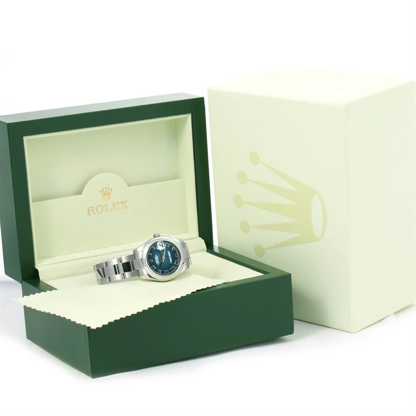 This image shows a Rolex Mid-Size 178240 Women's Stainless Steel Blue Dial 178240 Women's Stainless Steel Blue Dial watch placed inside an open green and beige Rolex box, with the outer box partially visible.