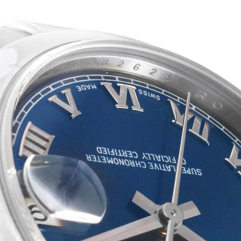 This close-up angle shows the dial and hands of a Rolex Mid-Size 178240 Women's Stainless Steel Blue Dial 178240 Women's Stainless Steel Blue Dial watch, highlighting the Roman numerals and date magnifier.