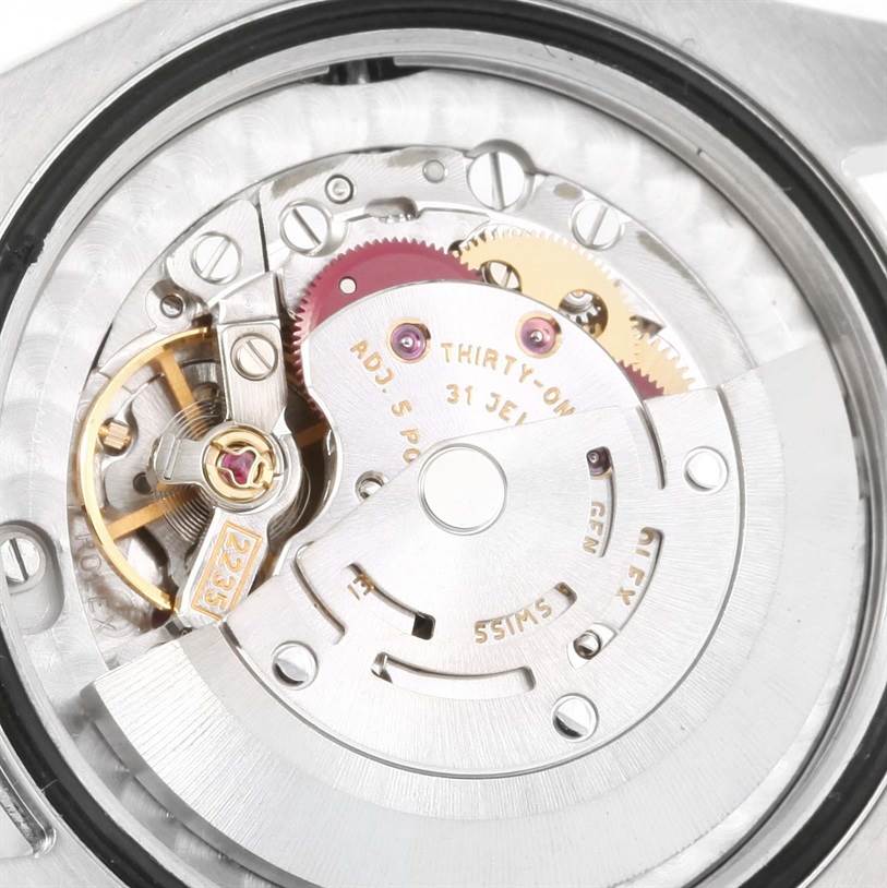 This image shows the internal mechanism of a Rolex Mid-Size 178240 Women's Stainless Steel Blue Dial 178240 Women's Stainless Steel Blue Dial model watch, viewed from the back, highlighting the movement and rotor.