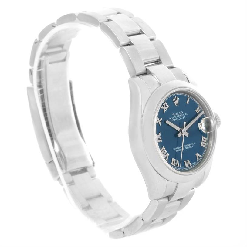 This image shows a side-angle view of a Rolex Mid-Size 178240 Women's Stainless Steel Blue Dial 178240 Women's Stainless Steel Blue Dial watch, highlighting its blue dial, roman numerals, and metal bracelet.