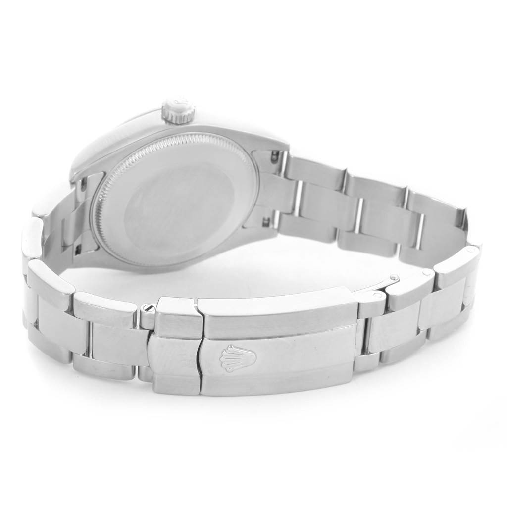 The image shows the back case and bracelet clasp of a Mid-Size Rolex watch at an angled rear view.