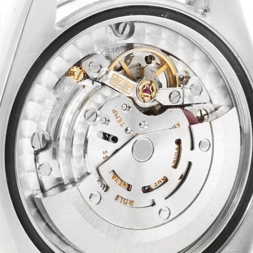 The image shows the internal mechanical movement and components of a Mid-Size Rolex watch from an overhead angle.