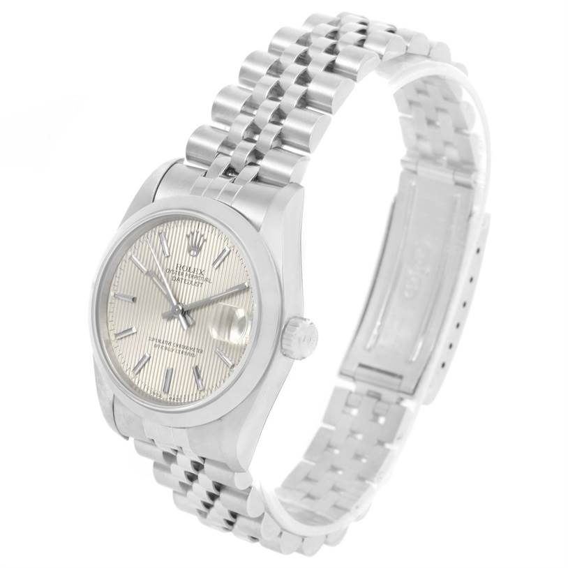 This image displays a side angle view of the Rolex Mid-Size 68240 Women's Stainless Steel Silver Dial 68240 Women's Stainless Steel Silver Dial model, showing the face, bezel, crown, and bracelet.
