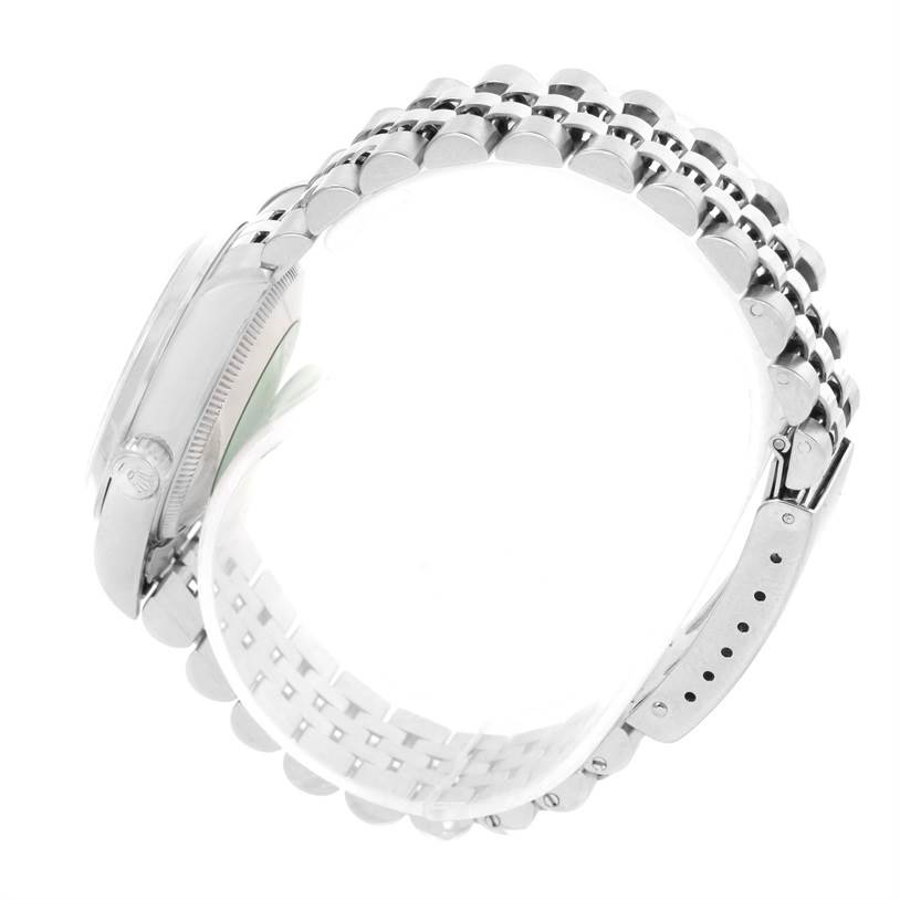 This image shows the side profile of a Rolex Mid-Size 68240 Women's Stainless Steel Silver Dial 68240 Women's Stainless Steel Silver Dial model watch, highlighting its bracelet and clasp.