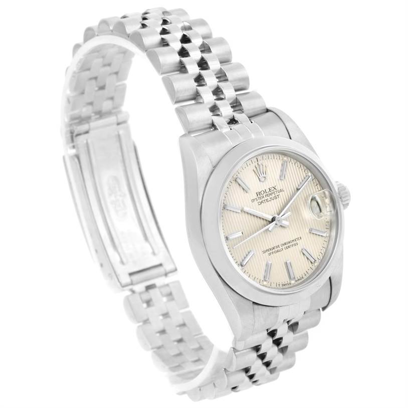 This image shows a side view of a Rolex Mid-Size 68240 Women's Stainless Steel Silver Dial 68240 Women's Stainless Steel Silver Dial model, featuring the watch face, bracelet, and clasp.