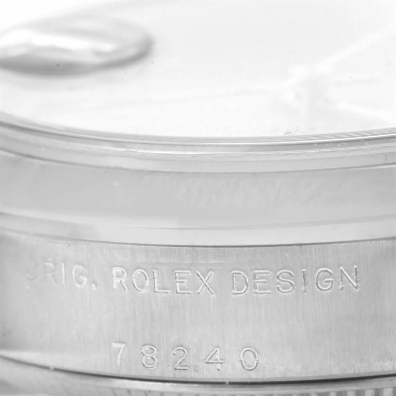 This image shows a close-up of the side engraving on a Mid-Size Rolex watch with serial number 78240.