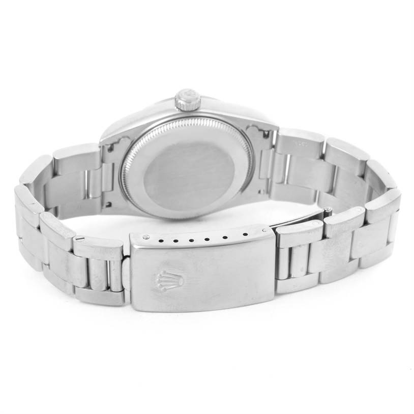 The image shows the back view of a Rolex Mid-Size 78240 Women's Stainless Steel Pink Dial 78240 Women's Stainless Steel Pink Dial watch, highlighting its case back, crown, and stainless steel bracelet.