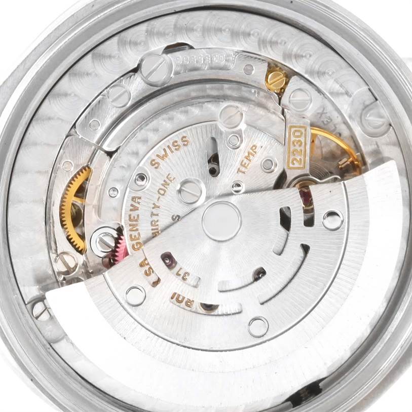 This image displays the internal mechanism of a Rolex Mid-Size 77080 Women's Stainless Steel Blue Dial 77080 Women's Stainless Steel Blue Dial watch, showcasing gears and the rotor.