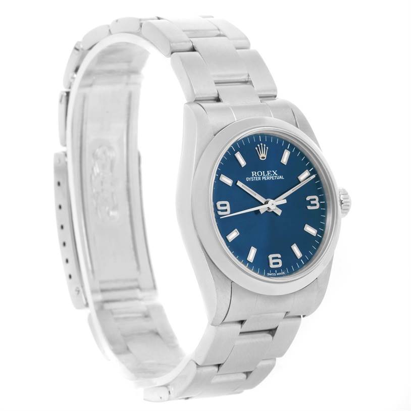 This image shows the front and side view of a Rolex Mid-Size 77080 Women's Stainless Steel Blue Dial 77080 Women's Stainless Steel Blue Dial watch featuring a blue dial and silver bracelet.