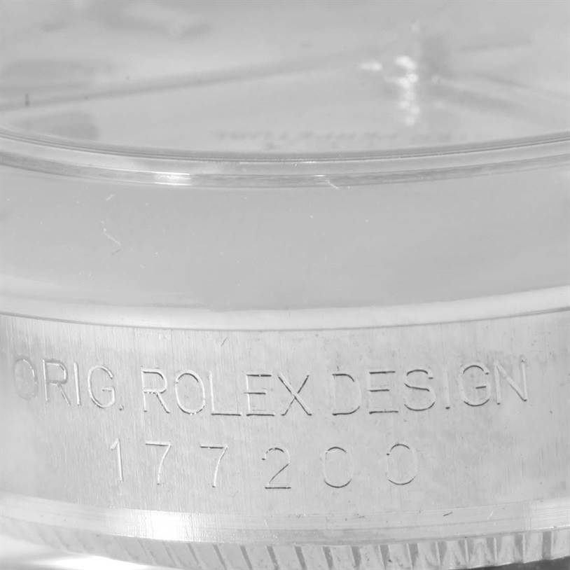 Close-up shot of the side of a Rolex Mid-Size 177200 Women's Stainless Steel Silver Dial 177200 Women's Stainless Steel Silver Dial model watch, showing the "ORIG. ROLEX DESIGN" engraving and model number 177200.