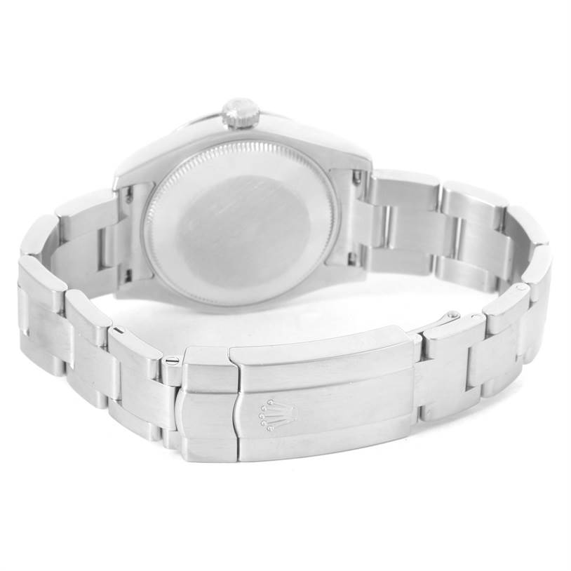 The image shows the back view of a Mid-Size Rolex watch, highlighting the clasp, bracelet, and case back.