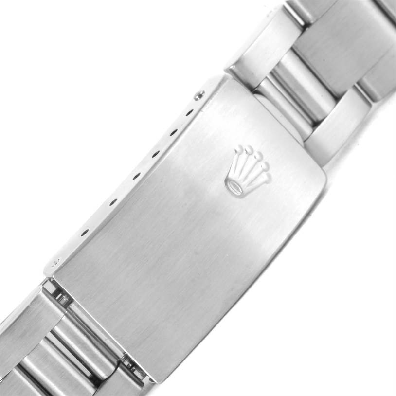 This image shows the clasp of a Rolex Mid-Size 67480 Women's Stainless Steel Black Dial 67480 Women's Stainless Steel Black Dial model watch bracelet from a top-down angle.