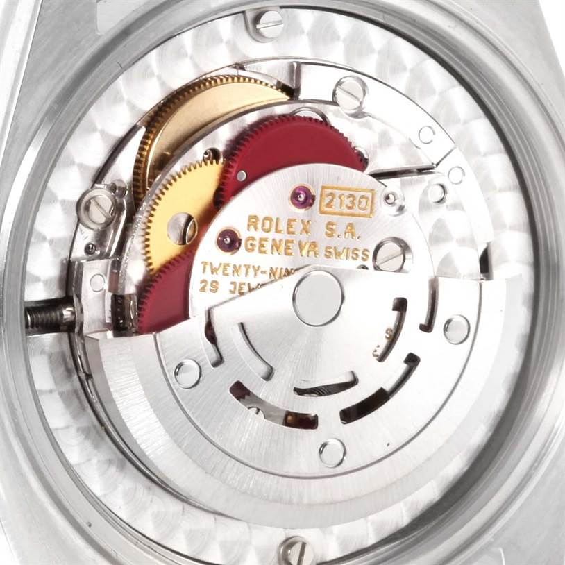 This image shows the movement mechanism of a Mid-Size Rolex watch.