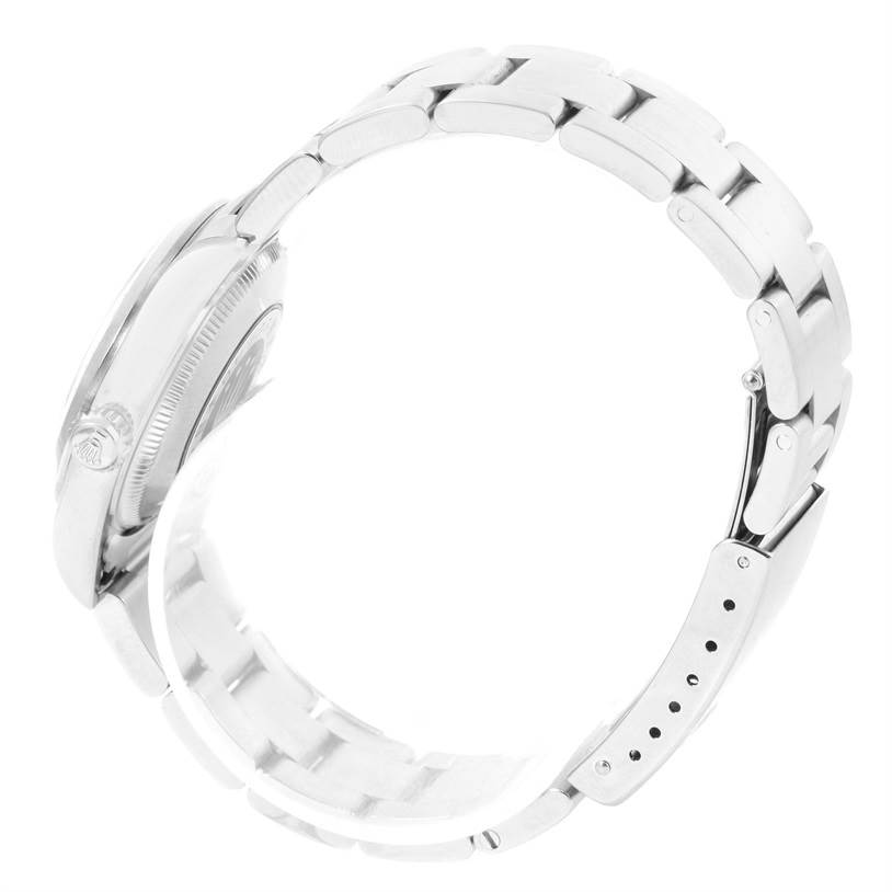 The image shows a side view of a Rolex Mid-Size 67480 Women's Stainless Steel Black Dial 67480 Women's Stainless Steel Black Dial model watch, highlighting the band and part of the case.