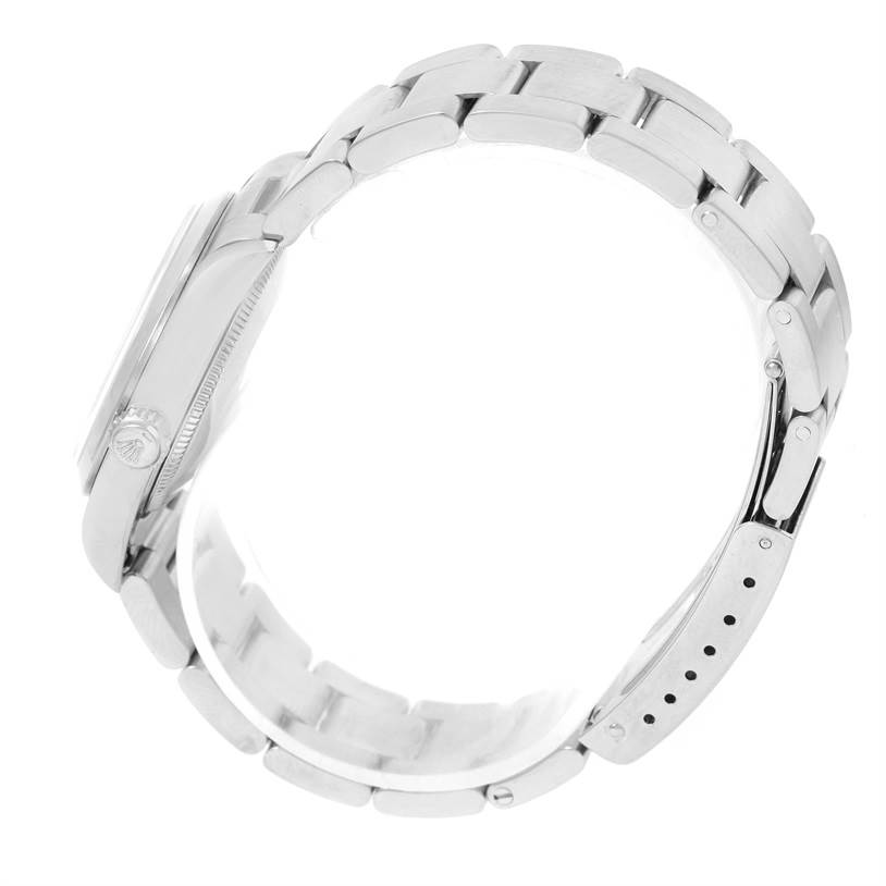 This image shows a side view of a Rolex Mid-Size 77080 Women's Stainless Steel Black Dial 77080 Women's Stainless Steel Black Dial model watch, highlighting its case, crown, and bracelet links.