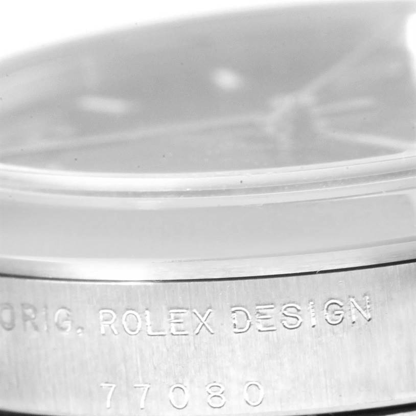 The image shows a close-up side view of a Mid-Size Rolex watch, highlighting the bezel with "ORIG. ROLEX DESIGN 77080" engraved.