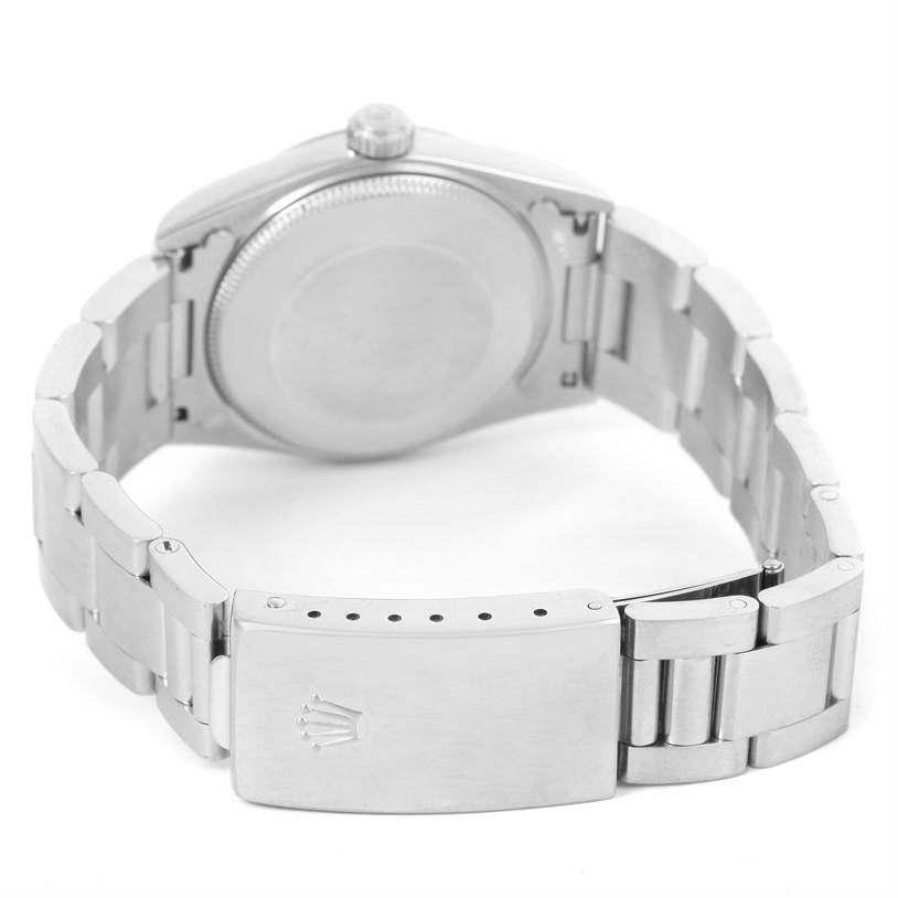 This image shows the back view of a Rolex Mid-Size 77080 Women's Stainless Steel Black Dial 77080 Women's Stainless Steel Black Dial watch, highlighting its clasp and case back.