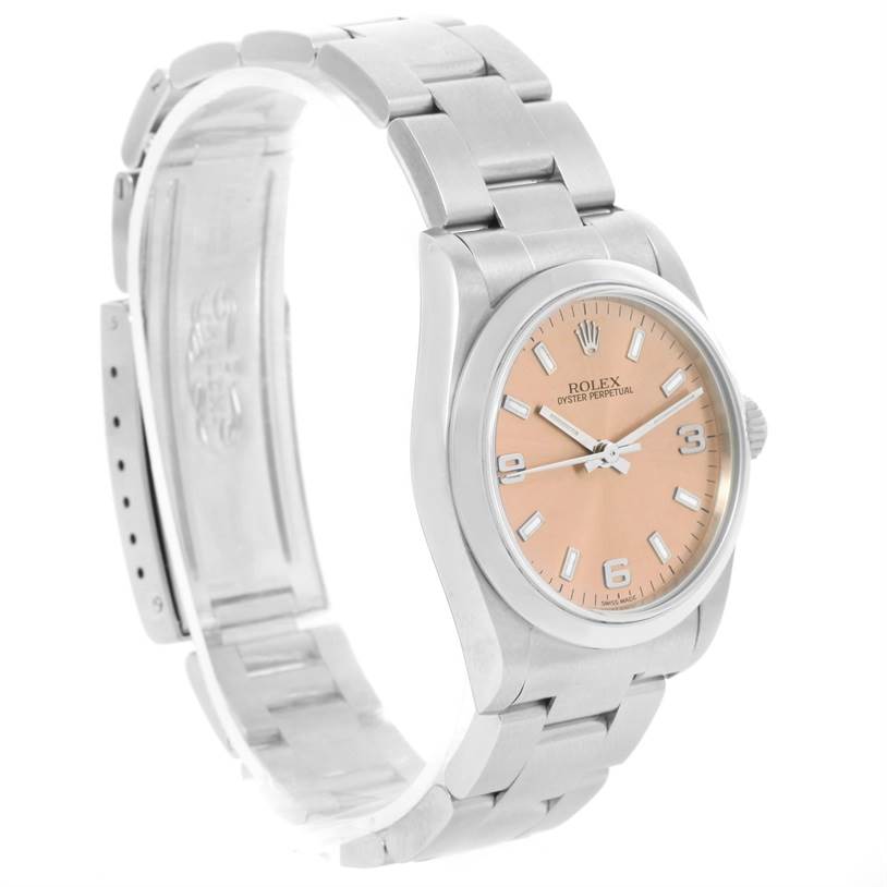 This image shows a Rolex Mid-Size 77080 Women's Stainless Steel Pink Dial 77080 Women's Stainless Steel Pink Dial Oyster Perpetual watch from a side angle, highlighting the open clasp, bracelet, and dial.