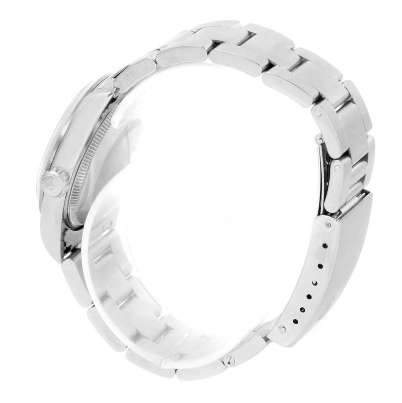 The image shows a side view of a Rolex Mid-Size 77080 Women's Stainless Steel Pink Dial 77080 Women's Stainless Steel Pink Dial watch, highlighting the bracelet and crown.