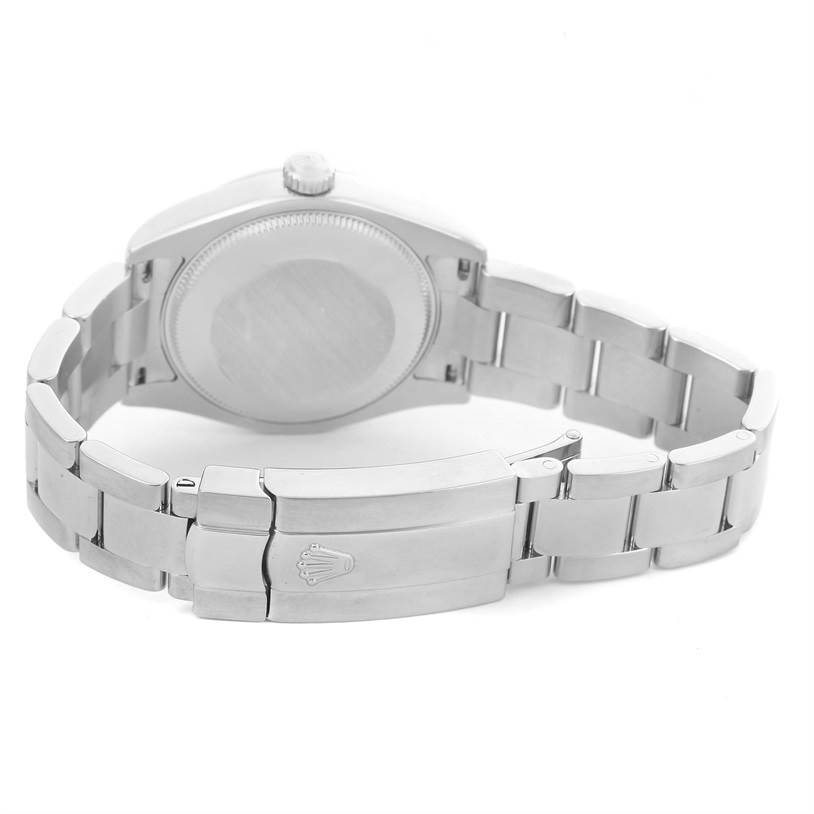 The image shows the rear view of a Mid-Size Rolex watch, featuring the case back, bracelet, and clasp with the Rolex logo.
