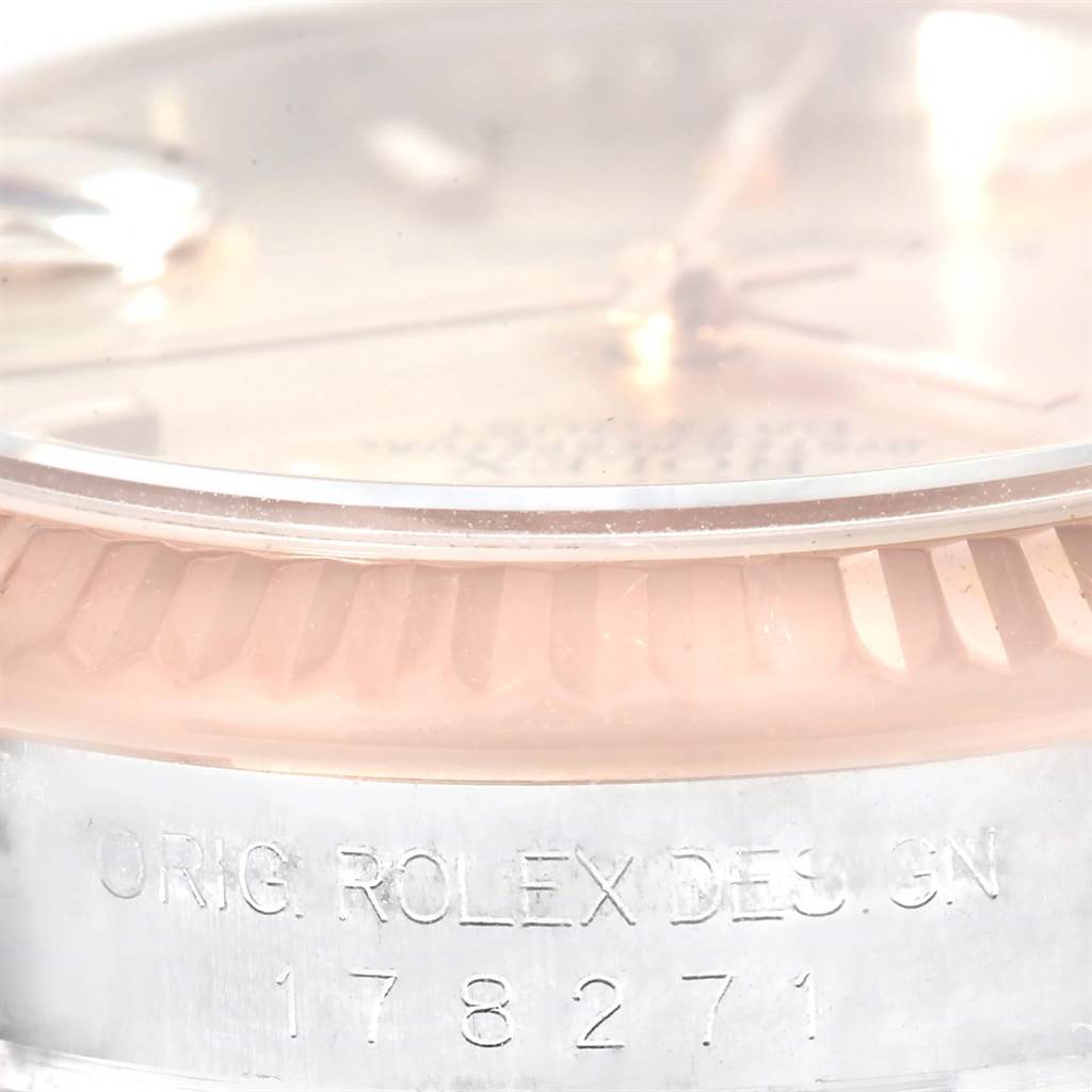 This close-up image shows the dial, bezel, and part of the case with model number engraving of a Rolex Mid-Size 178271 Women's Steel and Gold (two tone) Pink Dial 178271 Women's Steel and Gold (two tone) Pink Dial watch.