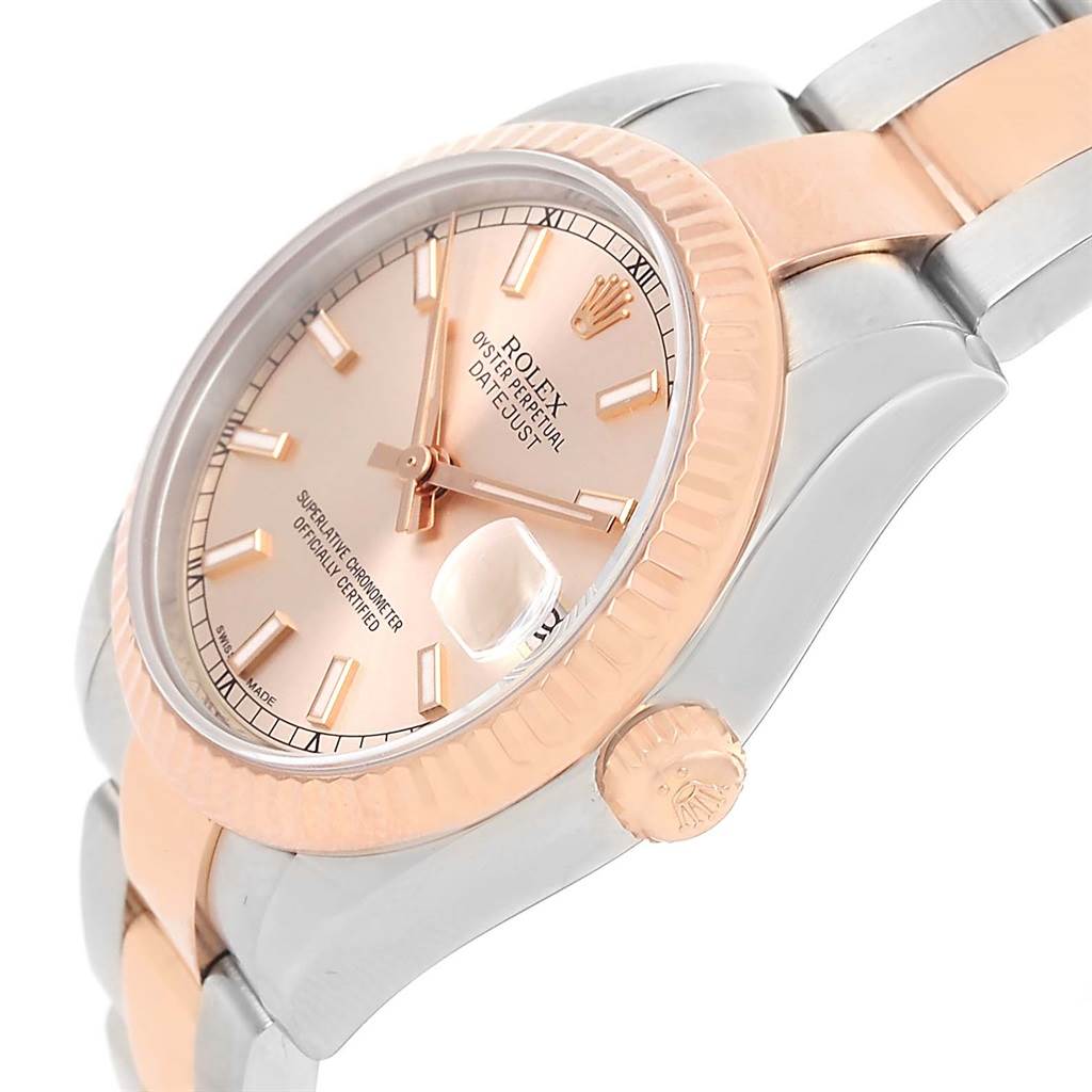 This image shows a close-up, angled view of a Rolex Mid-Size 178271 Women's Steel and Gold (two tone) Pink Dial 178271 Women's Steel and Gold (two tone) Pink Dial watch featuring its crown, dial, bezel, and part of the bracelet.