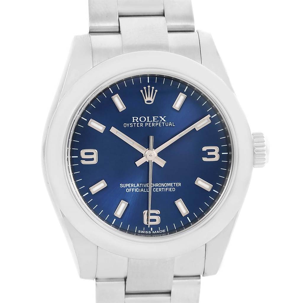 This image shows a front view of a Rolex Oyster Perpetual Mid-Size watch with a blue dial and stainless steel band.