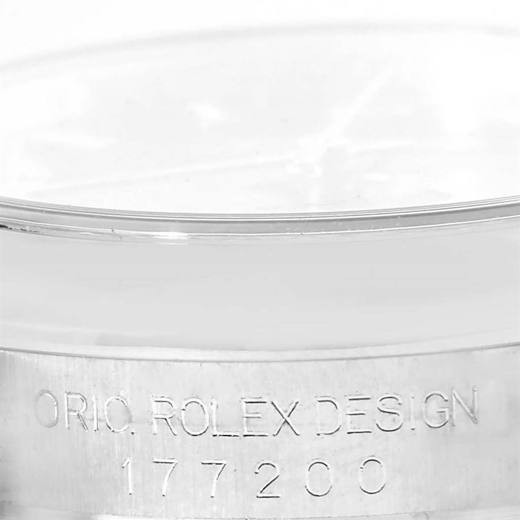 The image shows the engraved serial number and "Original Rolex Design" text on the side of a mid-size Rolex watch case.