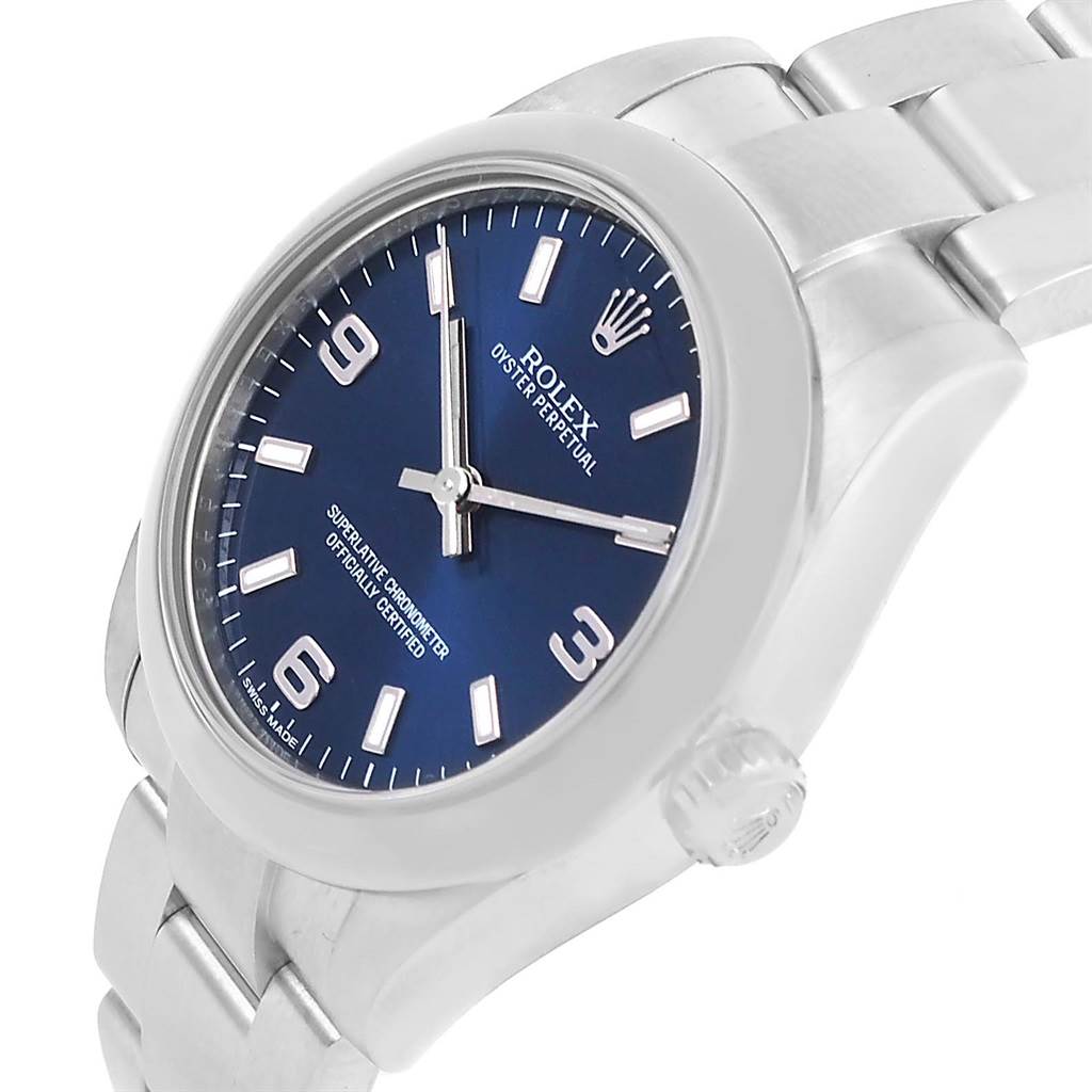 The Rolex Mid-Size 177200 Women's Stainless Steel Blue Dial 177200 Women's Stainless Steel Blue Dial model is shown at an angle highlighting its blue dial, stainless steel case, and bracelet with the crown visible.