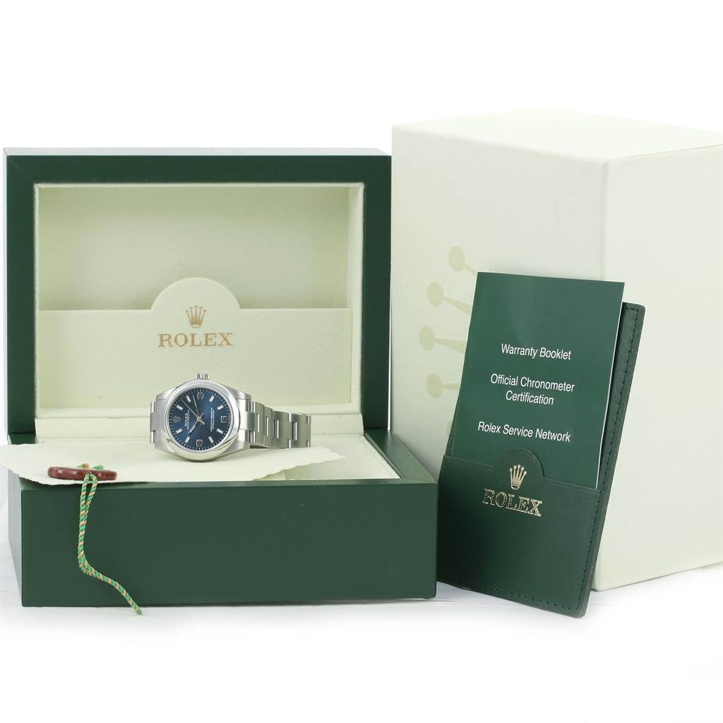 This image shows a Mid-Size Rolex watch in its box, alongside warranty booklets and Rolex branding.