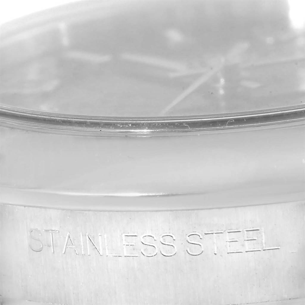 This image shows a close-up side view of a Rolex Mid-Size 177200 Women's Stainless Steel Blue Dial 177200 Women's Stainless Steel Blue Dial watch's stainless steel case and crystal.