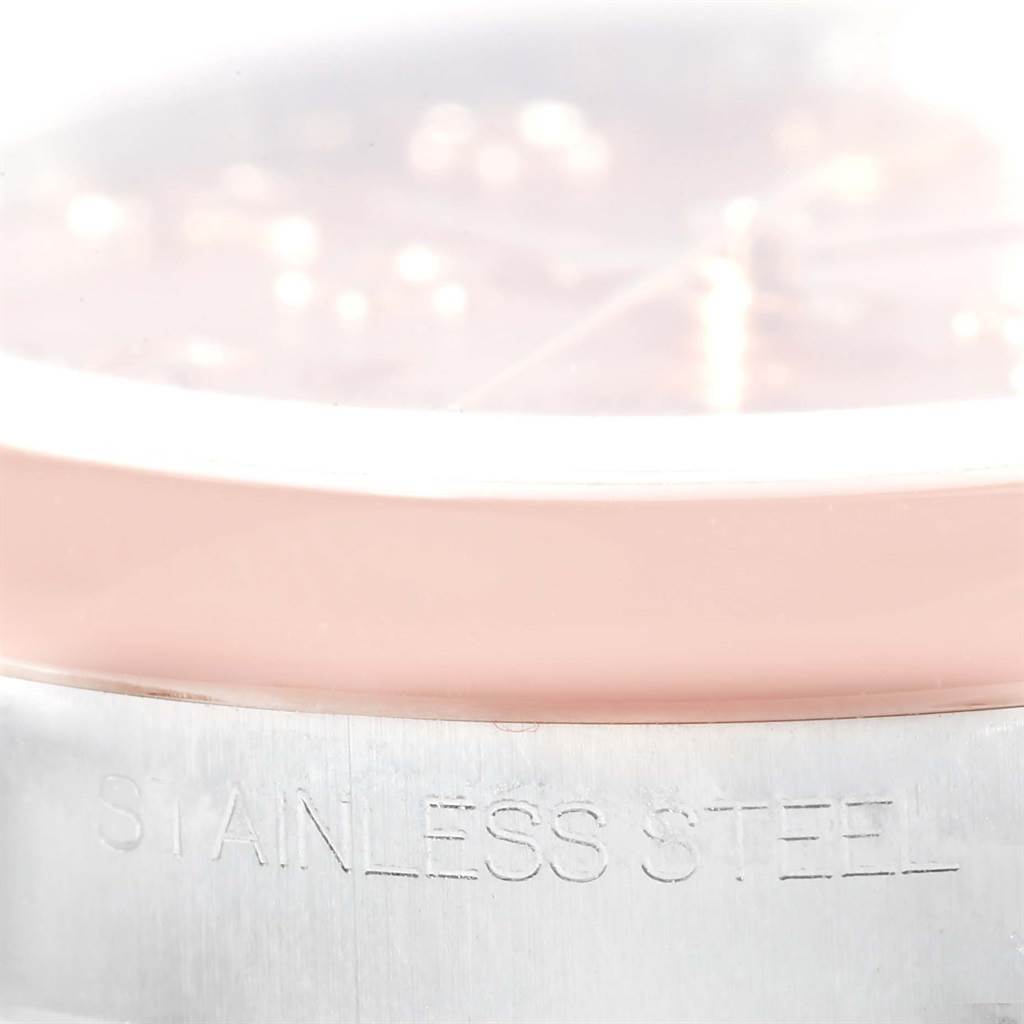 Close-up side view of the Rolex Mid-Size 178241 Women's Steel and Gold (two tone) Pink Dial 178241 Women's Steel and Gold (two tone) Pink Dial watch, showing the stainless steel case and a portion of the face.