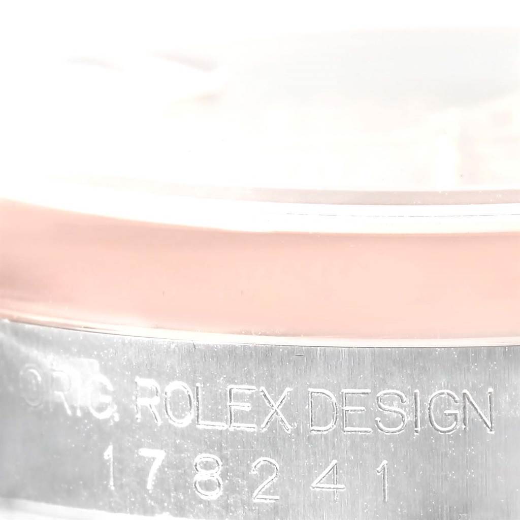 The image shows a close-up of the side case of a Rolex Mid-Size 178241 Women's Steel and Gold (two tone) Pink Dial 178241 Women's Steel and Gold (two tone) Pink Dial model, specifically focusing on the engraved text and serial number.
