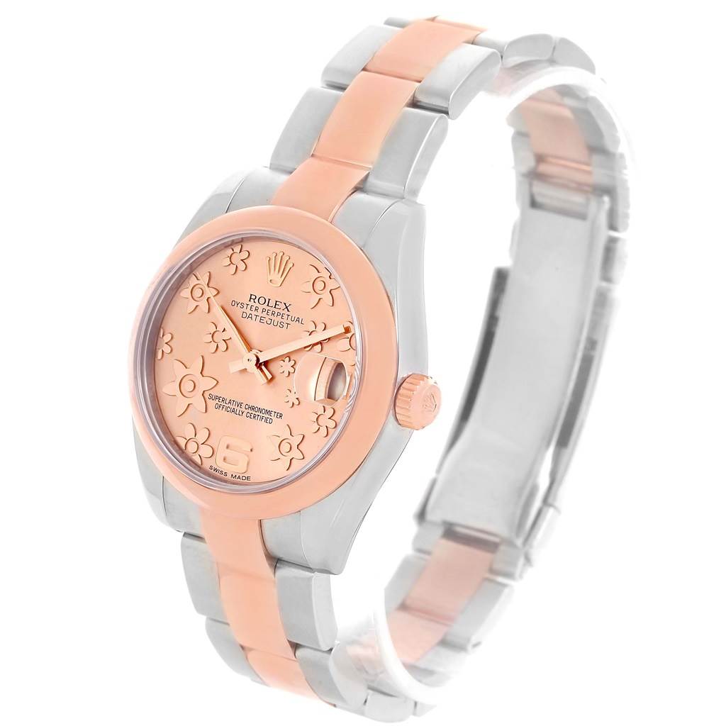 The mid-size Rolex Datejust watch is shown at a three-quarter angle, highlighting its rose and silver-toned bracelet and floral detailed dial.