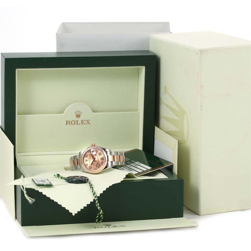 The image shows a Mid-Size Rolex watch on display, along with its box, warranty card, and tags.