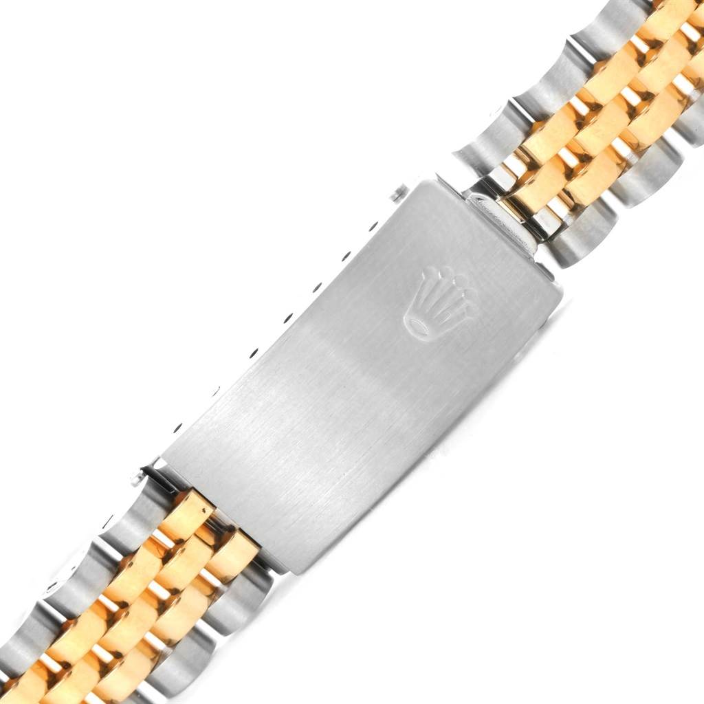 This is a close-up of the bracelet and clasp of a Rolex Mid-Size 68273 Women's Steel and Gold (two tone) Beige Dial 68273 Women's Steel and Gold (two tone) Beige Dial watch, featuring a two-tone design with the iconic crown logo.