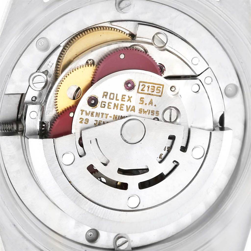 The image shows an internal view of the Rolex Mid-Size 68273 Women's Steel and Gold (two tone) Silver Dial 68273 Women's Steel and Gold (two tone) Silver Dial watch, highlighting the movement mechanism and components.
