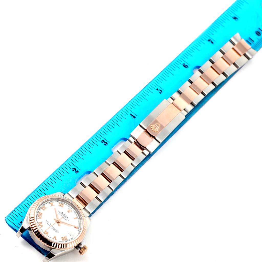 The image shows a Rolex Mid-Size 178271 Women's Steel and Gold (two tone) White Dial 178271 Women's Steel and Gold (two tone) White Dial watch laid flat, with a ruler measuring the entire length from the watch head to the clasp.