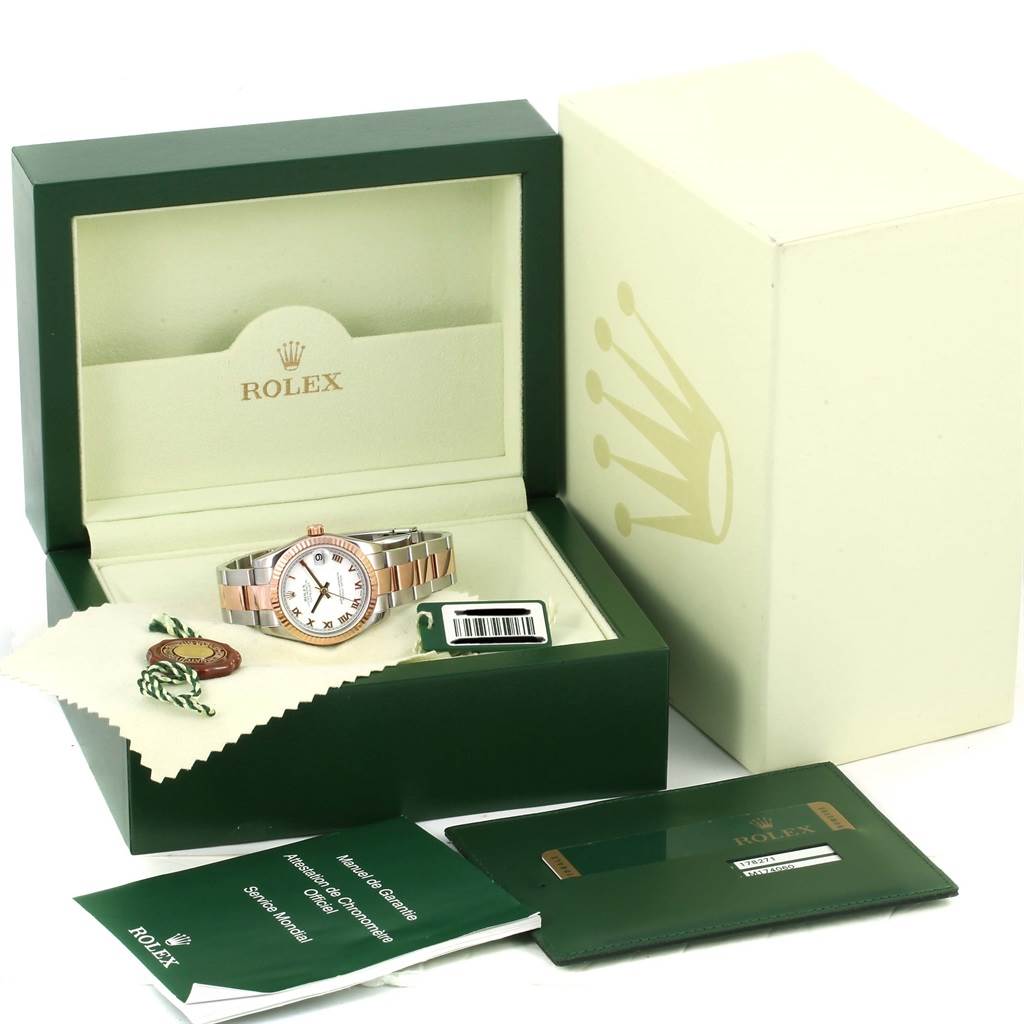 The image shows a Rolex Mid-Size 178271 Women's Steel and Gold (two tone) White Dial 178271 Women's Steel and Gold (two tone) White Dial watch in its open box alongside warranty card, manuals, and a cleaning cloth.