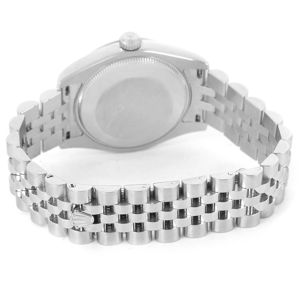 The image shows the back of a Mid-Size Rolex watch, highlighting the case back and metal bracelet.