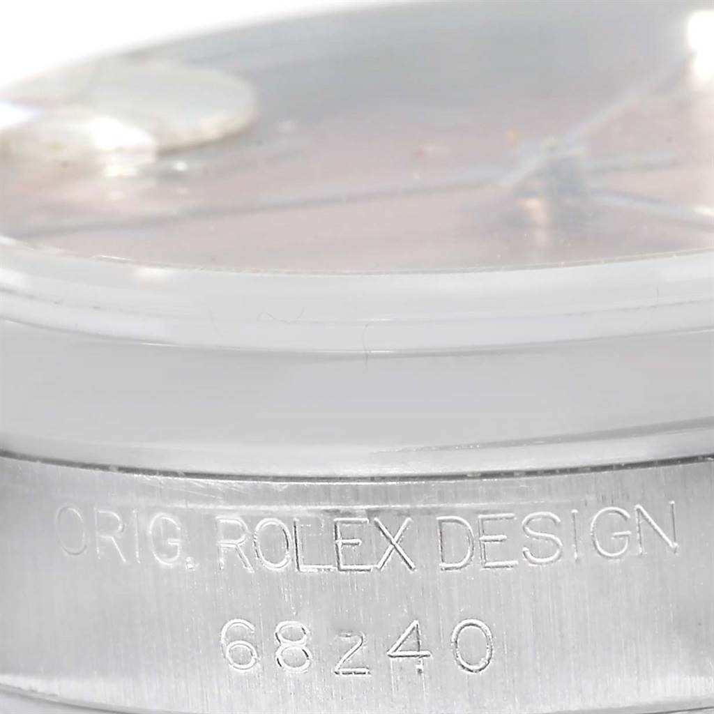 This image shows a close-up view of the case side of a Mid-Size Rolex watch, highlighting the engraved model number 68240.