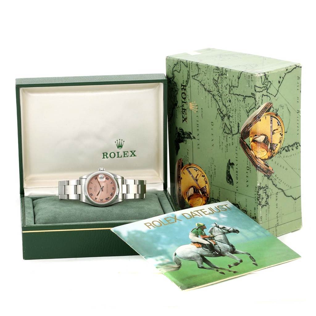 The image shows a Rolex Mid-Size 68240 Women's Stainless Steel Pink Dial 68240 Women's Stainless Steel Pink Dial watch in an open green box alongside its packaging and a Rolex Datejust booklet.