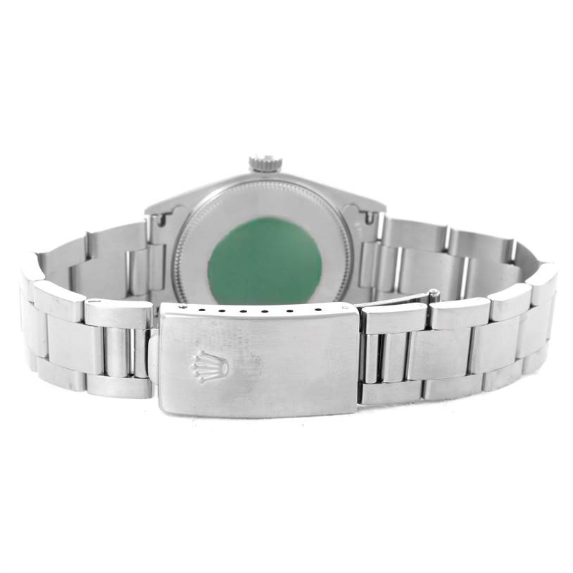 This image shows the back case and clasp of a Rolex Mid-Size 77080 Men's Stainless Steel Black Dial 77080 Men's Stainless Steel Black Dial watch, highlighting its stainless steel bracelet and logo.