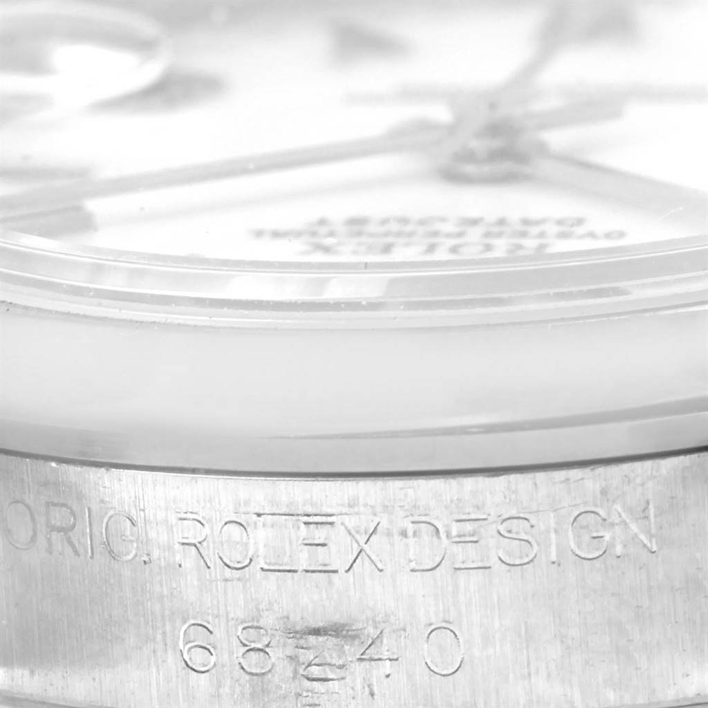 The image shows a close-up of the side of a Mid-Size Rolex watch, highlighting the engraving "ORIG. ROLEX DESIGN 68240."