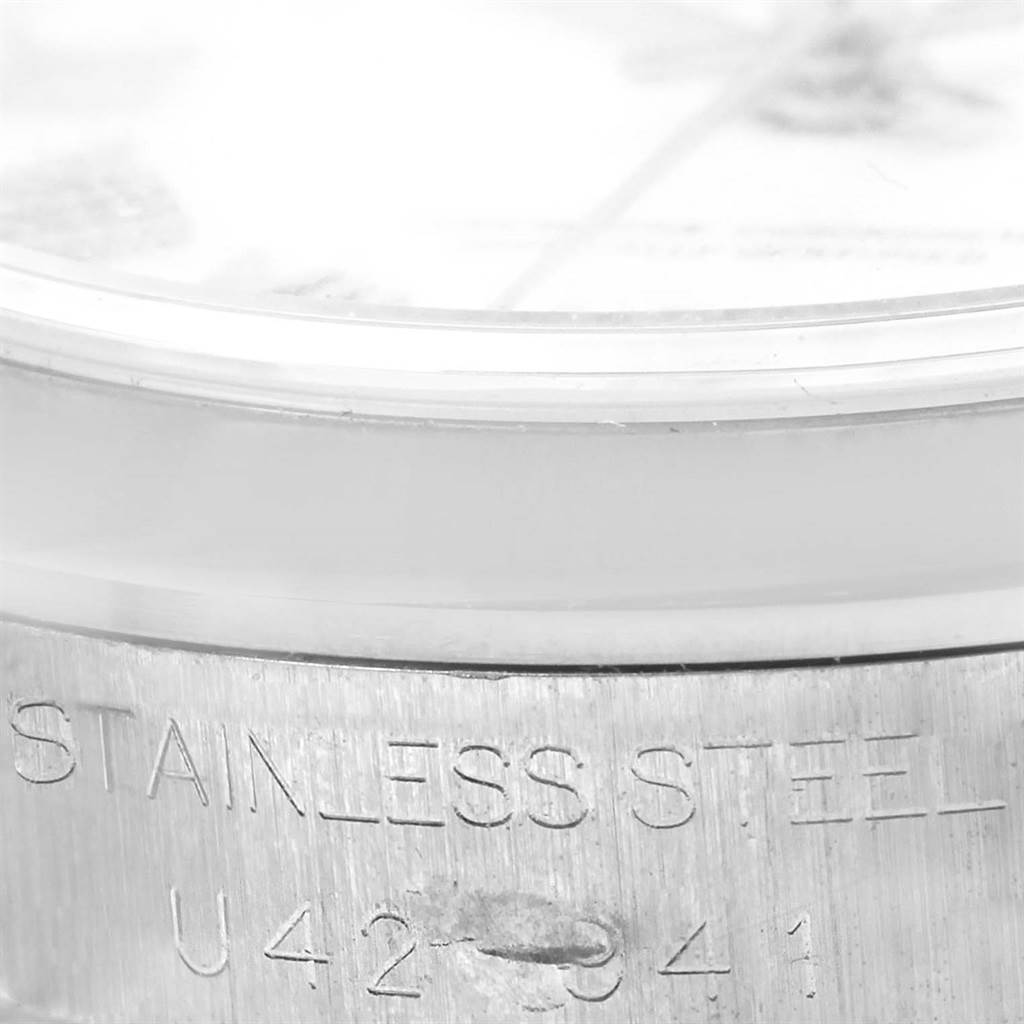 The image shows a close-up of the side stainless steel casing of a Rolex Mid-Size 68240 Women's Stainless Steel White Dial 68240 Women's Stainless Steel White Dial model watch.