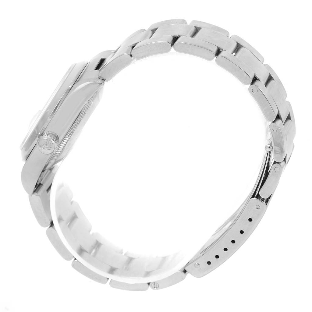 This image shows a side view of the Mid-Size Rolex watch, focusing on the band and the case profile with the winding crown visible.