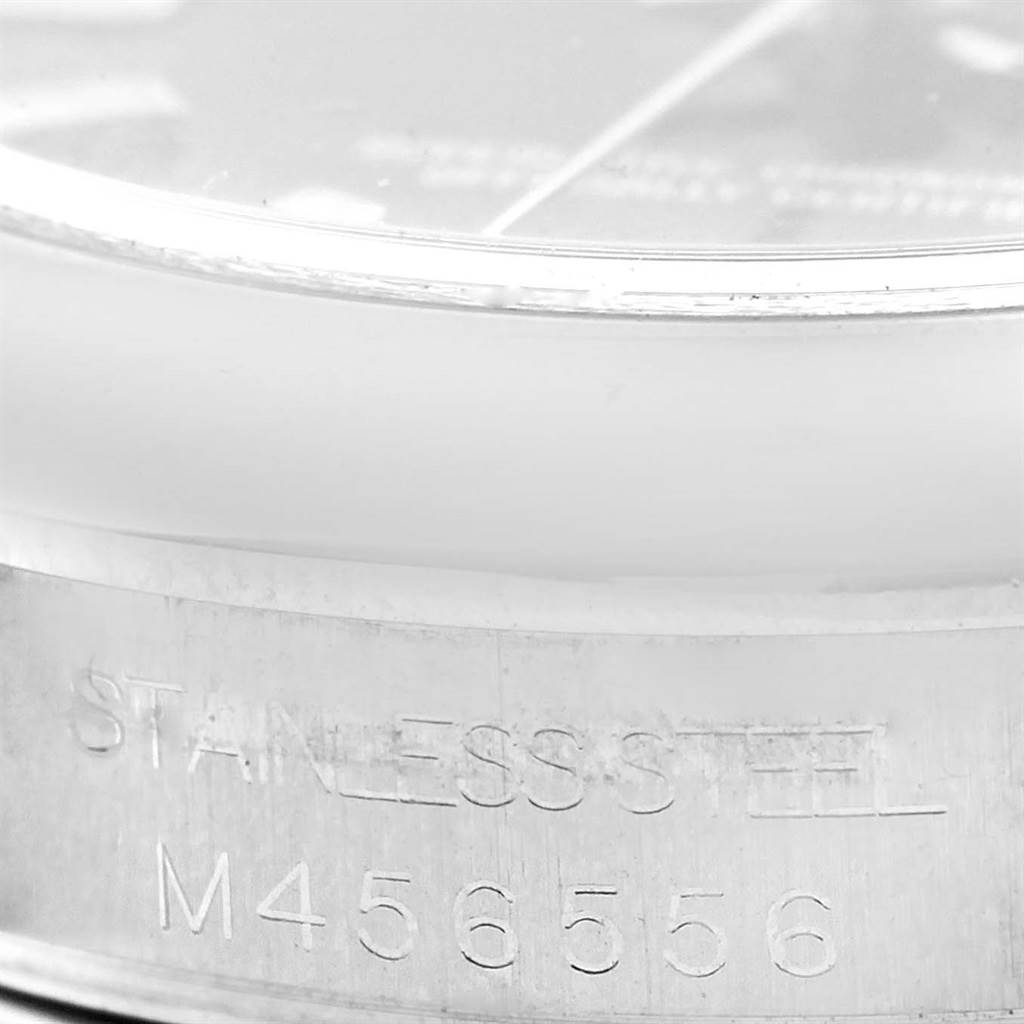 This image shows a close-up of the side of a Rolex Mid-Size 177200 Women's Stainless Steel Black Dial 177200 Women's Stainless Steel Black Dial watch, highlighting the stainless steel text and serial number.