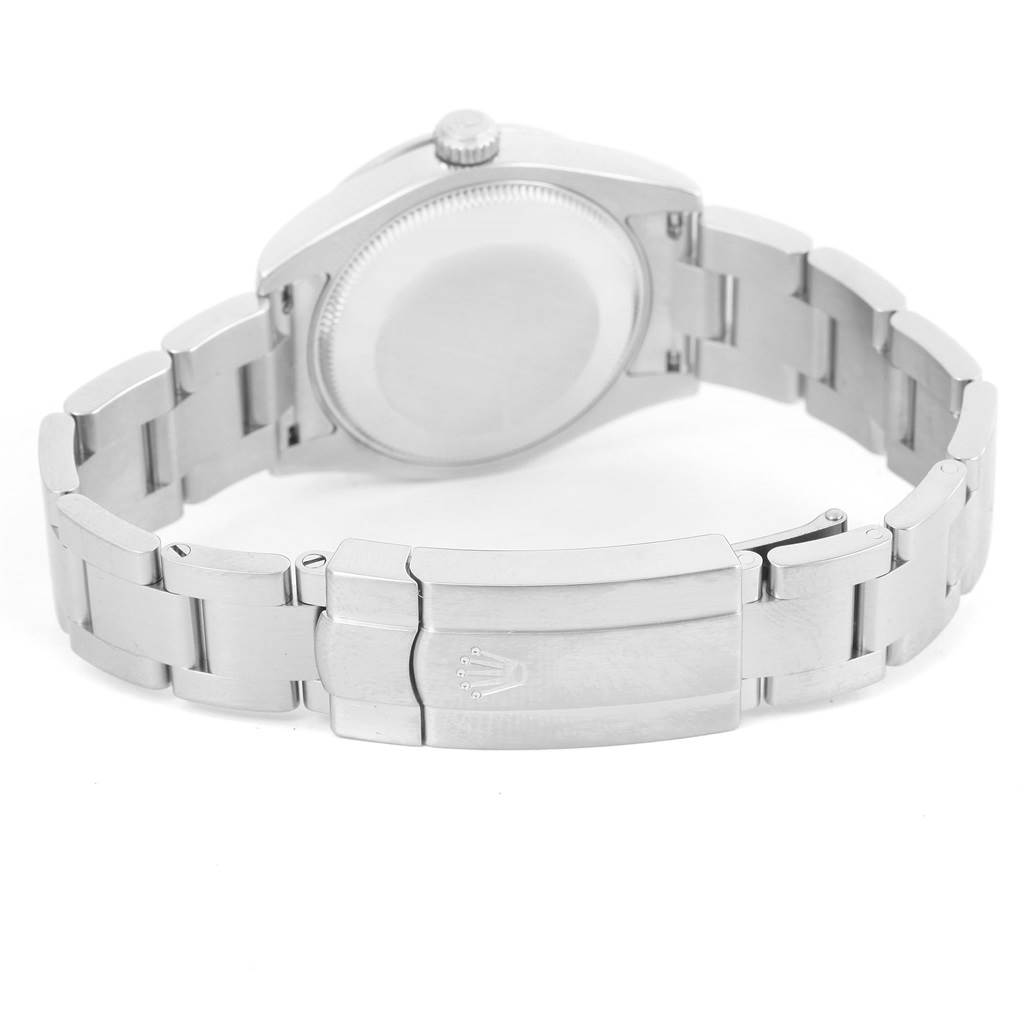 The image shows the back view and clasp of a Rolex Mid-Size 177200 Women's Stainless Steel Black Dial 177200 Women's Stainless Steel Black Dial model watch with a metal bracelet.