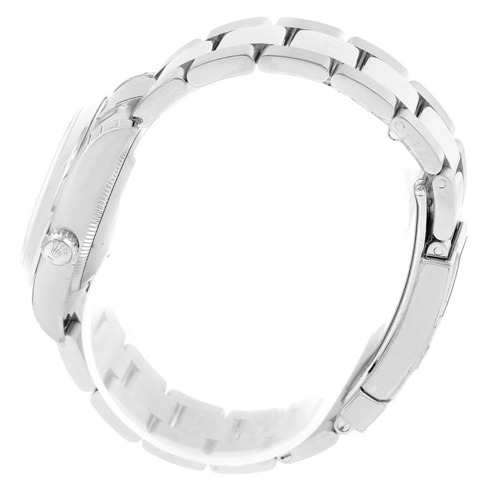 The image shows a side view of a Mid-Size Rolex watch, highlighting the crown, case, and part of the bracelet.